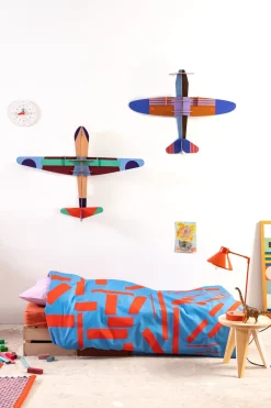 Wanddeko Papier 'Leuchtendes Papierflugzeug'